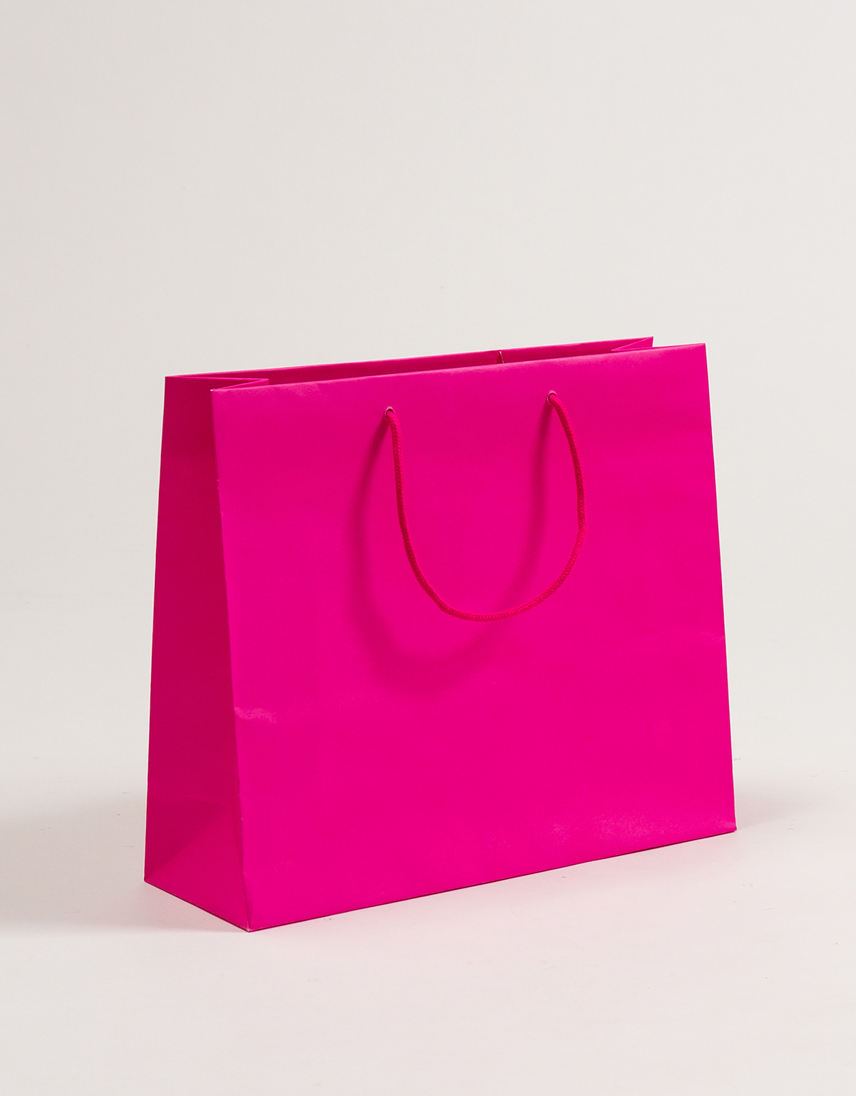 Produktbild Papiertragetaschen POP mit Stoffkordel pink in der Größe 36 x 12 x 31 + 5 cm