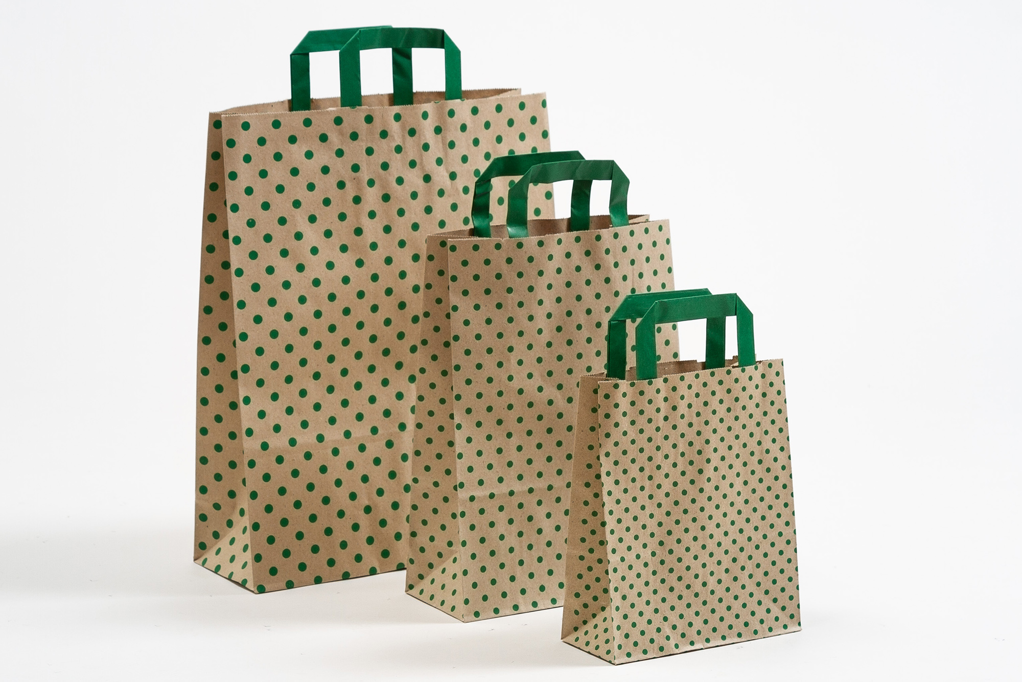 Gruppenbild Papiertragetaschen mit Flachhenkel aus Graspapier mit grünen Punkten