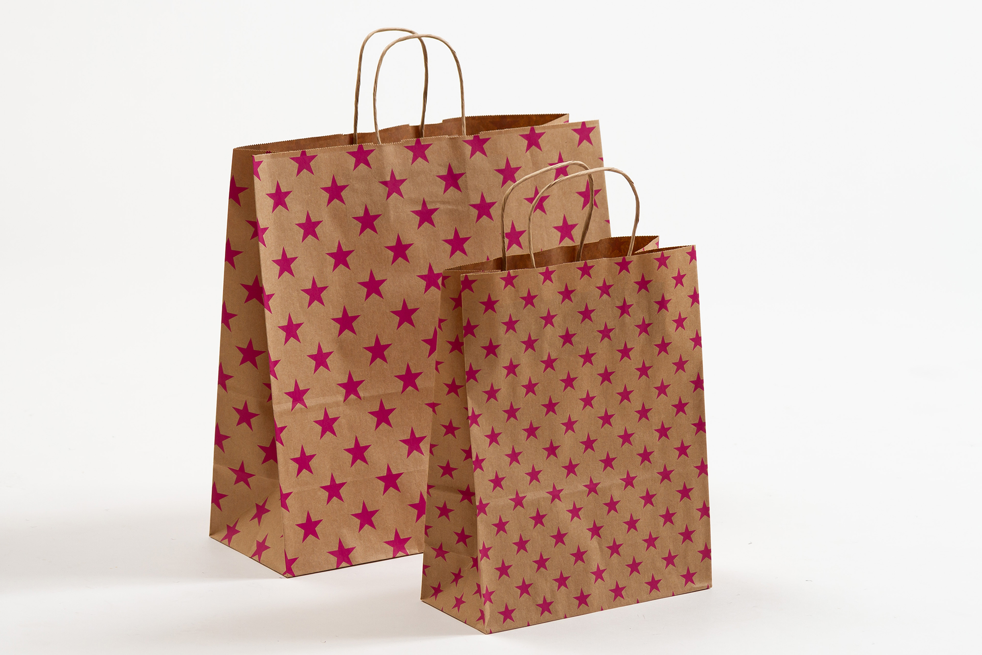 Gruppenbild SALE Papiertragetaschen mit gedrehter Papierkordel Sterne pink