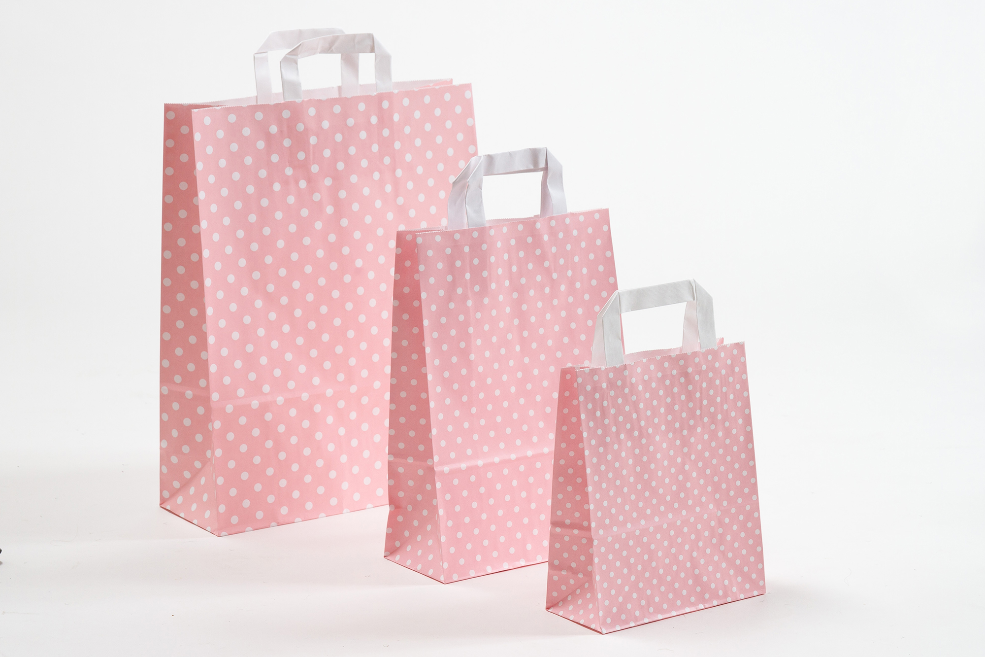 Gruppenbild Papiertragetaschen mit Flachhenkel rosa mit Punkten