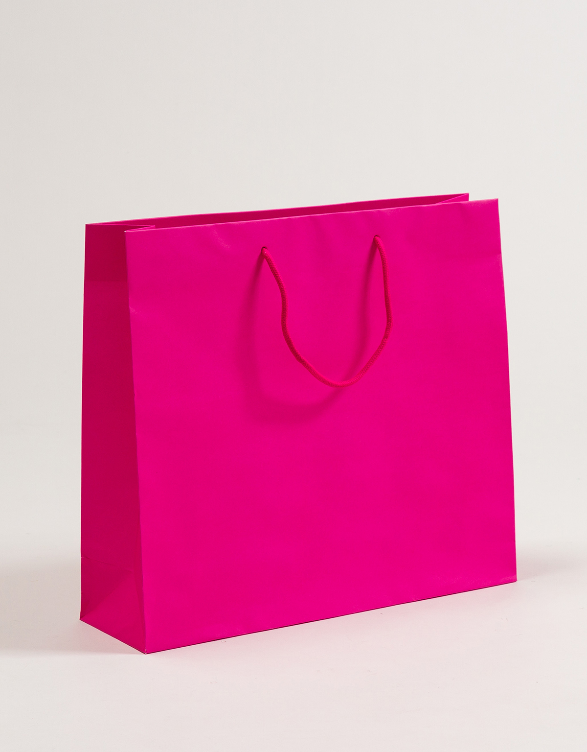 Produktbild Papiertragetaschen POP mit Stoffkordel pink in der Größe 40 x 12 x 36 + 5 cm